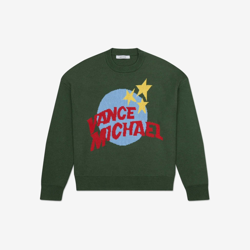 Green graphic sweater on a white background.