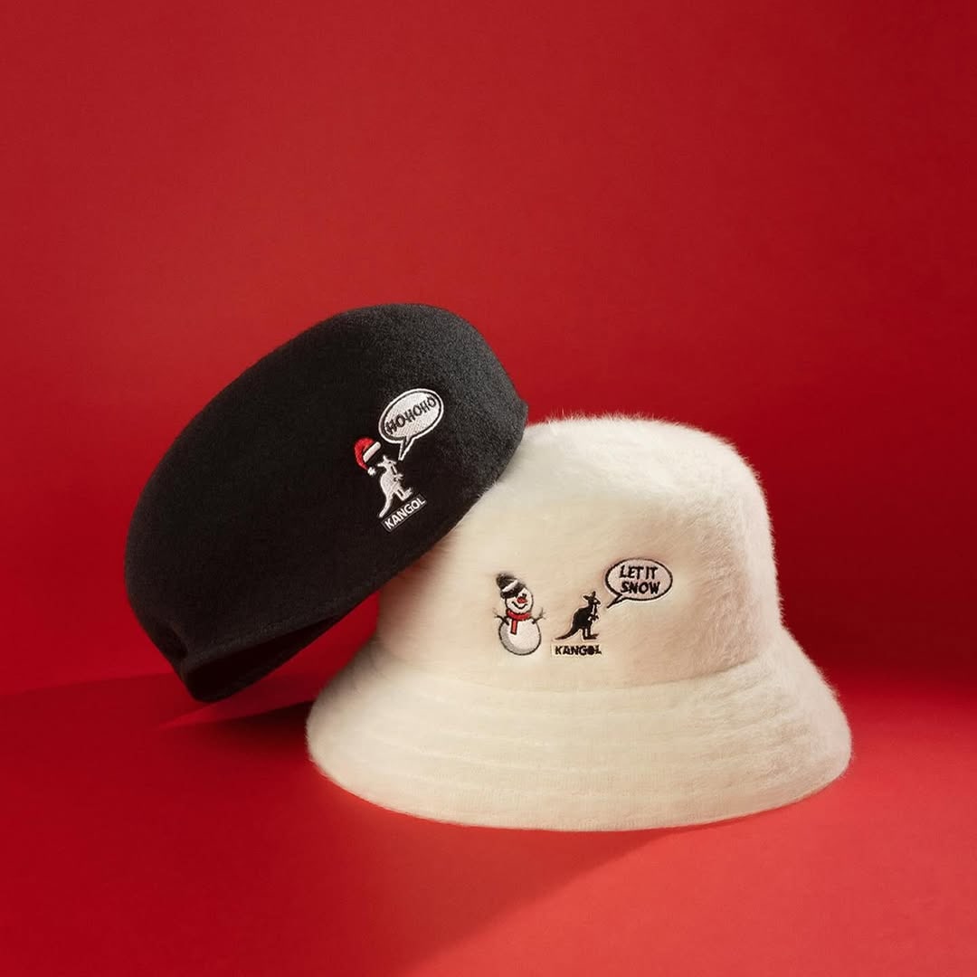 Two bucket hats photographed in a creative studio setup on red background