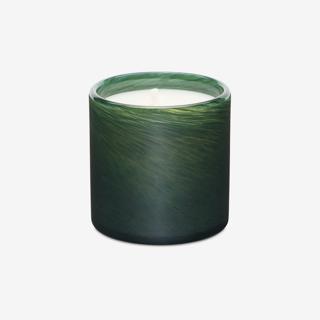 Dark green ceramic cup with textured surface on white background.